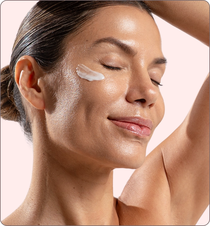 Woman smiling with serum on her cheek beside FAQ section explaining ILLU Daily Serum benefits, usage, and skin type compatibility.