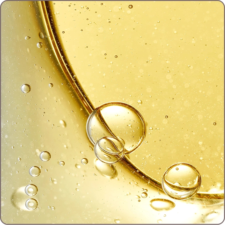 Detailed shot of Argireline serum texture showing golden microbubbles that help minimize fine lines and relax skin tension.