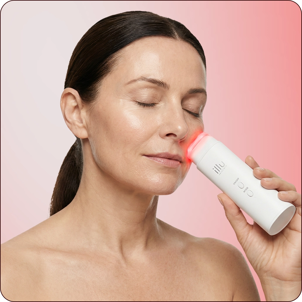 Woman using ILLU Face Toner on her cheek with light therapy, demonstrating a simple three-step skincare routine for hydration, repair, and glow.
